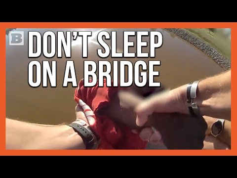 Read more about the article Heroic Rescue: Officer and Good Samaritan Save Man from Bridge Plunge!