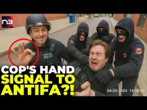 Read more about the article New Angle on Cop’s Hand Signal to Antifa Raises Big Questions